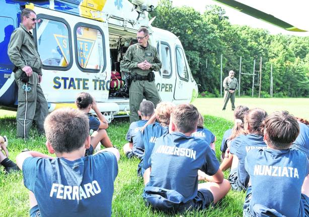 Cadets are given a presentation by New Jersey State Police Aviation helicopter pilot, Sgt. Evan Curtiss.