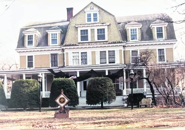 The Idylease building has a black drape over the porch in 1992 to mourn the death of Dr. Arthur Zampella, M.D.