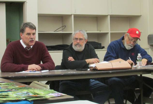 PHOTO BY ANN GENADER Seen from left discussing environmental factors related to a solar project proposal at the Friends of Wallisch Homestead meeting are, from left, Friends President John Hefferon, Treasurer David Ofshinsky and Ron Perez, board member in charge of construction.