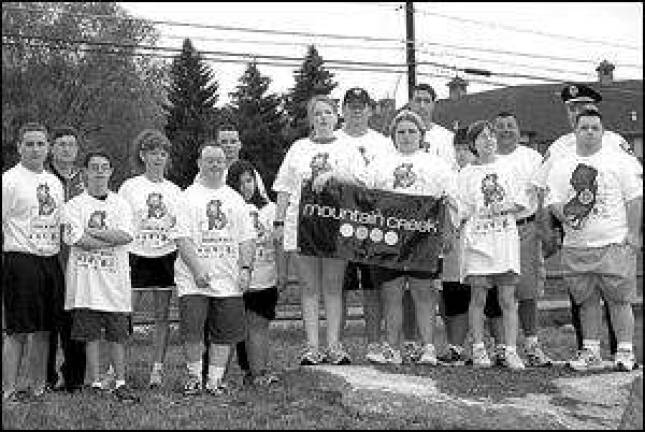 Vernon police officers carry the torch for Special Olympics