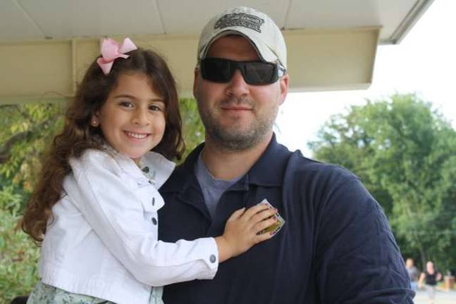 Julianna Kayal gave a hug to her dad, Mike, before starting her first day of kindergarten Wednesday at UGL.