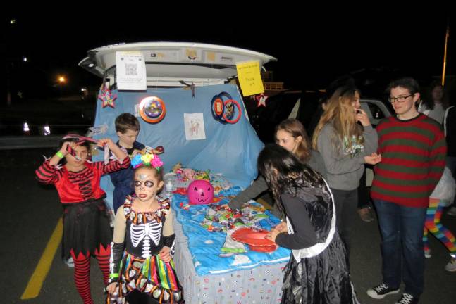 Halloween goodies are given out during the &quot;Trunk or Treat&quot; at West Milford High School. photo by patricia Keller