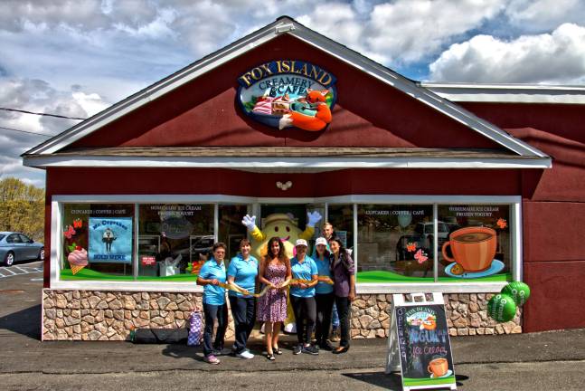 Photos by Don Webb of Spider Webb Photography From left, owners Elena Dykstra and Sharon Mines, Mayor Bettina Bieri, mascot Mr. Fro in back, Rebecca Dykstra, Sue O'Neil, Peter Wacht and Lisa Bok, Froyo World representative.