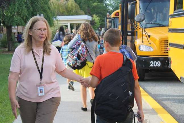 Christine Witt greeted many students Wednesday morning at UGL Elementary School.