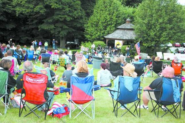 Up and down the hill, the folks came out to sit and enjoy the music of the "Farmer Phil" band.