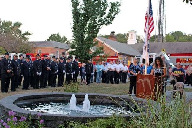 Photos by Ginny Raue Mayor Bettina Bieri takes to the podium as members of the town's emergency services stand by.