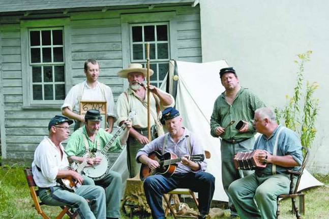 The 6th New Hampshire Regiment Contra Band played Civil War music for visitors. From left, Greg Smith , Rob Brembt , Nathan Bedford, Donald Scar , Greg Boyden, Jeff Scar and Walt Dewey.