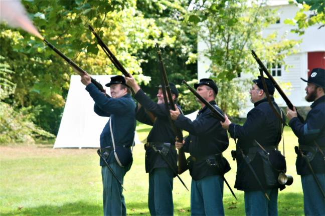 [Members of the 6th New Hampshire regiment Union Civil War reenactors hold a demonstration at the Long Pond Ironworks State Park in Hewitt on Saturday. Charles Kim photo]