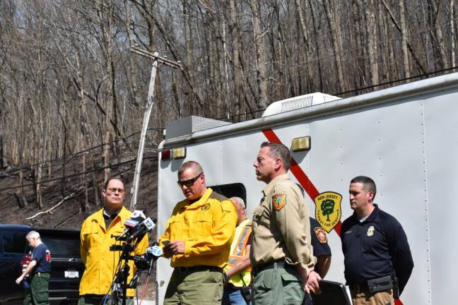 Eric Weber, assistant division firewarden for New Jersey, said this was the largest wildfire in West Milford since 2009. At left is John Cecil, assistant commissioner of State Parks, Forests and Historic Sites, and at right is Greg McLaughlin, chief of the New Jersey Forest Fire Service. (Photo by Rich Adamonis)