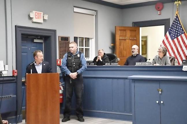 Rep. Josh Gottheimer, D-5, speaks to the West Milford Township Council on Wednesday, Jan. 18. Standing next to him is township Police Officer Michael Weber.