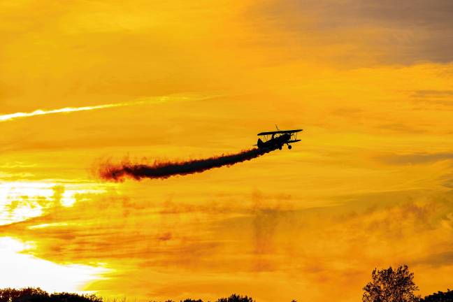 Third Strike wingwalkers at sunset Saturday, Sept. 20. (Photo by TJ Nolan)