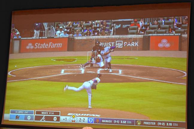 MLB umpire Jen Pawol behind home plate Sunday, Aug. 10 at Atlanta’s Truist Park.