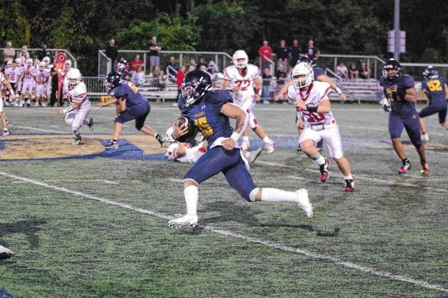 Jefferson ball carrier Braedan Cummings on the run in the game against Whippany Park at home Friday, Sept. 26. Jefferson won, 48-26, and Cummings made one touchdown. (Photos by George Leroy Hunter)