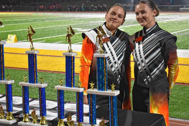 Members of the West Milford marching band prepare to hand out the trophies.