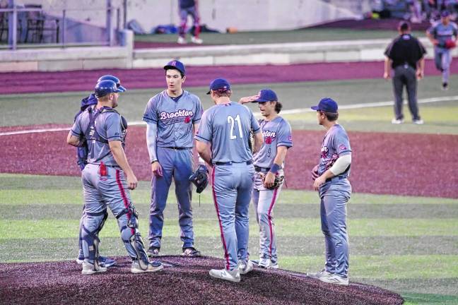 <b>The Brockton Rox meet on the pitchers mound.</b>