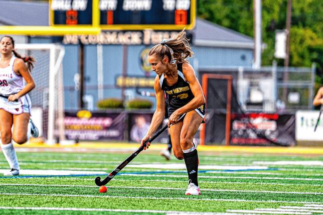 Junior Julia Plewa moves up the field.