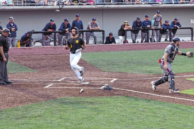 <b>MN2 The Miners’ Alec Sayre crosses home plate to score in the first inning, moving the team ahead of the Rox, 3-1.</b>