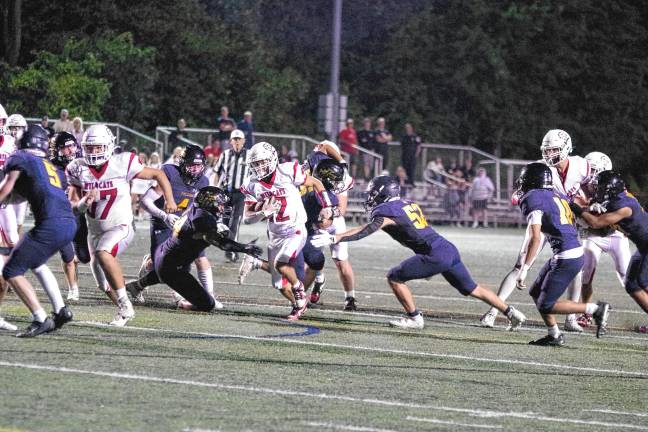 Whippany Park ball carrier Nick Casale runs through an opening in the Jefferson defense in the first half. He made it to the end zone for a touchdown. The extra point kick tied the score, 14-14, in the second quarter.