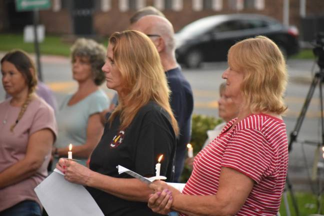 WM1 West Milford residents hold candles during a ceremony remembering those killed in Sept. 11, 2001, terrorist attacks. About 150 people attended the event. (Photos by Rich Adamonis)