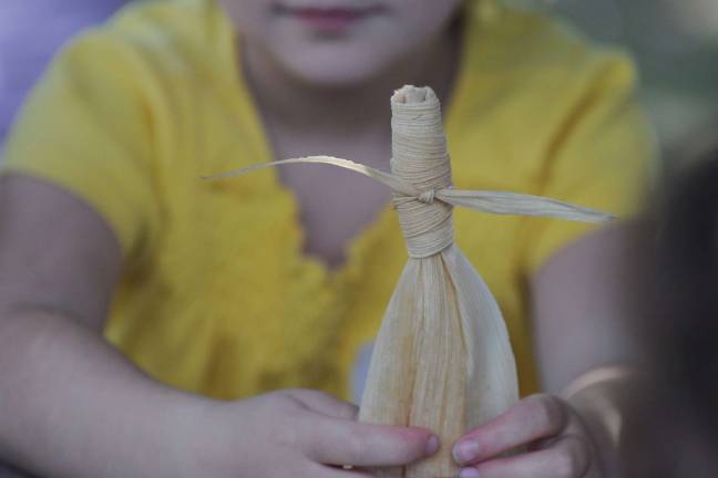 Photo credit, Bryan Haeffele The finished product of a corn-husk doll craft, one of the many hands-on activities we are offering.