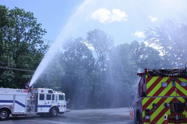 Pequannock Fire Co. #2 spouts an aerial christening to West Milford's newest tanker. Photo by Ginny Raue