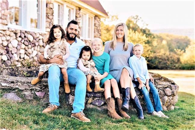 Alyssia and Josh Arnau with their children and step children.