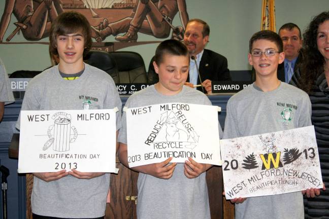 There were many designs submitted but the Beautification committee chose the one on the left here, drawn by Dean, a Macopin Middle School student. Also pictured are third place winner, Anthony, center, and second place winner Jared.