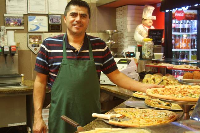 Photo by Linda Smith Hancharick Angel Morales, owner of Frank's Pizza, is thrilled to be moving right next door to where he is now, in the ShopRite Plaza.