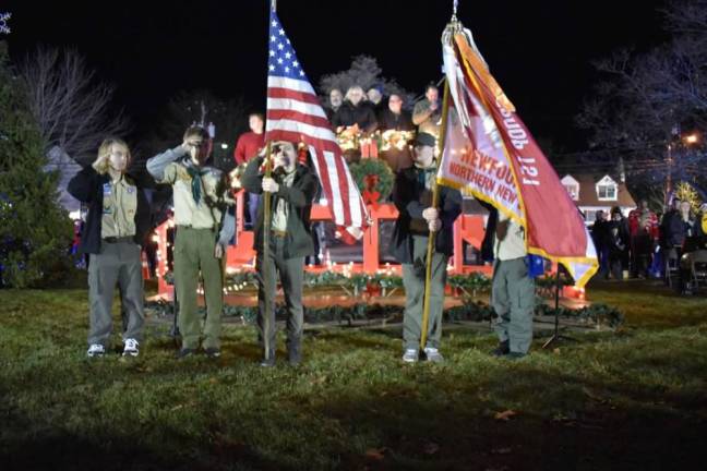 A Boy Scout Color Guard presents the flags. (Photo by Rich Adamonis)