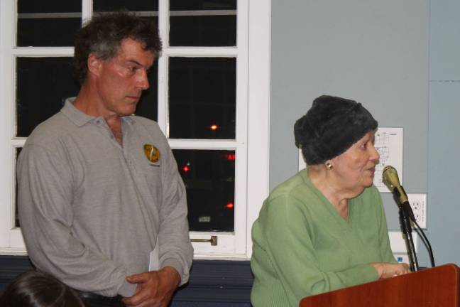 Photo by Linda Smith Hancharick Ella Filippone, New Jersey chairperson of the Greenwood Lake Commission, addressed the township council Wednesday night. Behind her is the West Milford representative on the commission, Eric Hastings.