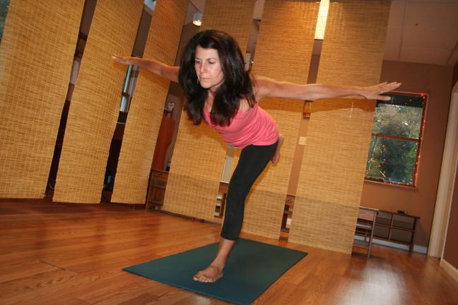 Michelle Morando demonstrates a yoga pose. She is the manager of Powers Yoga Center of West Milford and an instructor at the studio as well.