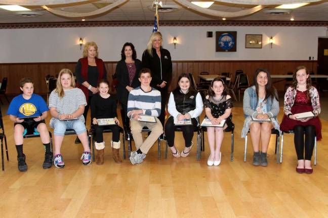 Photo providedThe winners of the West Milford Elks essay contest are pictured: Front row: Caitlin Murphy, right, Katelyn Matthews, Ally Struck, Dylan Connors, Leah Pontes, Madelyn Walter, Rosa Nichols-Melendez, Quinn Menier. Back row: Committee Co-Chair Mary Barrett, Linda Dolan and Tammy Roos.