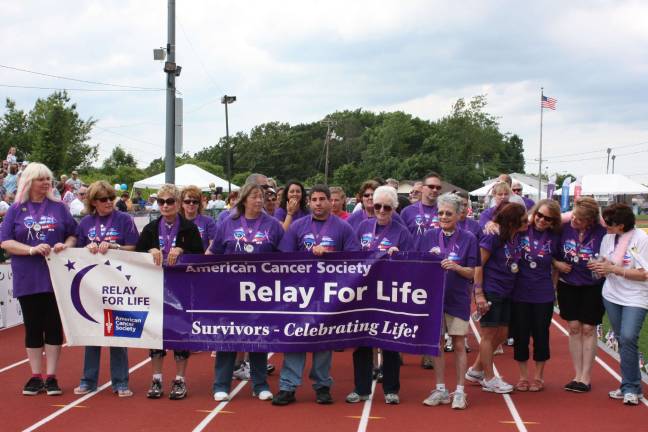 Relay for Life is a community event here in West Milford. The first lap - the survivor's lap - sets the tone for the event. Photo by Ginny Raue