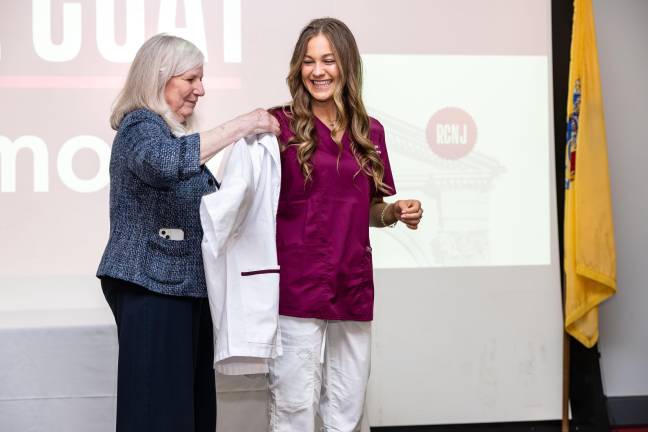Professor and Assistant Dean of Nursing Programs Kathleen Burke, left, with a nursing graduate at Ramapo College’s White Coat Ceremony. Photo provided by Ramapo College.