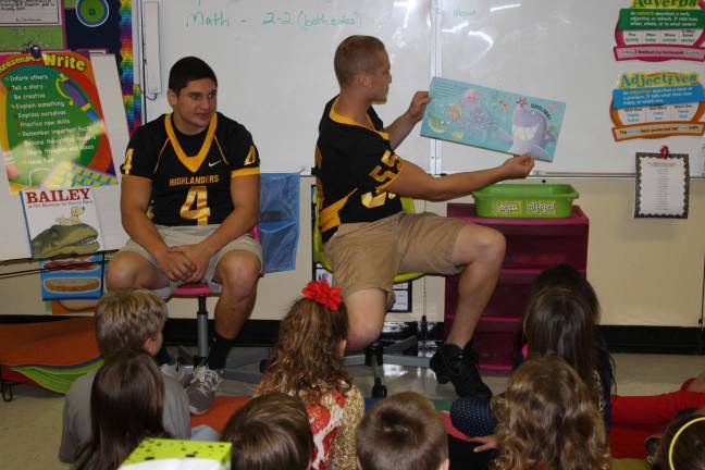 Photos by Linda Smith Hancharick When James Hoffman, right, finished reading the story book to Jennifer Casperson's third grade class, one student yelled &quot;I like that story!&quot; Shane LePore, #4, also read to the class.