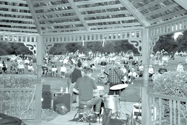 Photo by Ginny Raue Barry Ryan's Rockabilly X played at Bubbling Springs last summer as part of the Summer Concert Series.
