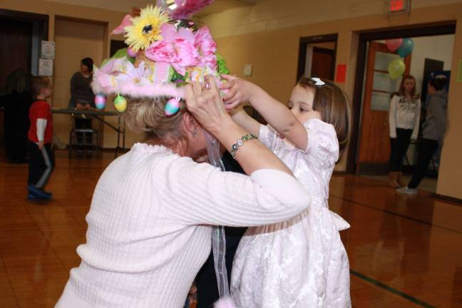 Sarah DeGraff decided that grandma should wear her Easter hat instead. Photo by Ginny Raue