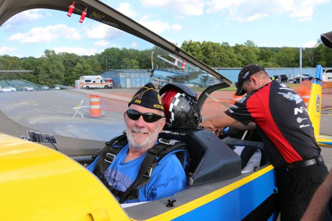 PHOTO BY DON WEBB American Legion Commander Bob Allwood at the Greenwood Lake Air Show last June. When he's not flying, he's cooking up some fine clams for veterans and other lucky folks.