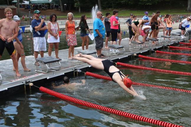 Colleen Coyman hits the water for her race. The West Milford swim team practices at Bubbling Springs and competes at many locations.