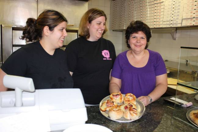 West Milford's Macopin Pizza has been a staple in the town for almost thirty years. Owner Lorraine Covello, is well known around town for her generosity in supporting many local fund raisers and events. Shown here, from left to right, Covello's daughters,Laura and Rosemarie, with their Mom, Lorraine. Photo by Ginny Raue
