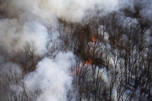 The wildfire near Route 23 in West Milford sends smoke into the air. (Photo courtesy of state Department of Environmental Protection)
