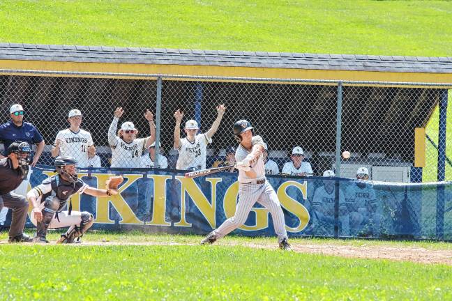 West Milford batter Brayden Primavera begins to swing the bat toward the incoming ball.