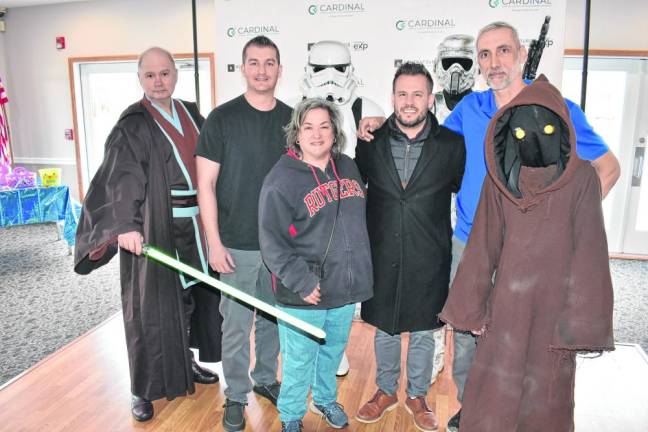 Organizers of the event pose with Star Wars characters.