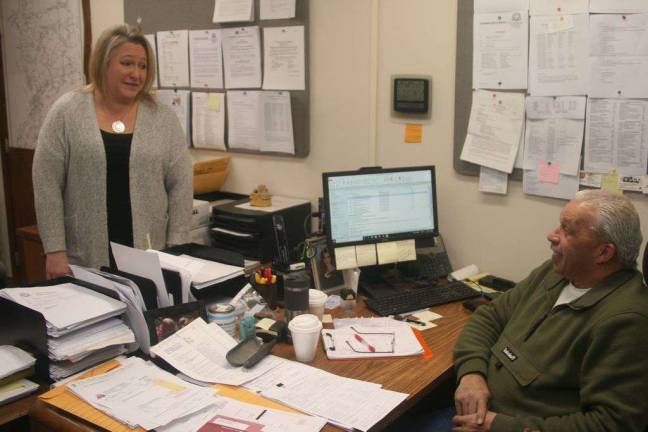 Mayor Michele Dale and OEM Coordinator Ed Steines discuss this week's winter weather at the DPW office Wednesday.