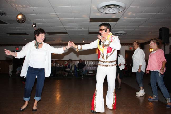 In her wildest dreams did Joyce Moninger ever imagine she'd be doing the stroll with "Elivs?"
