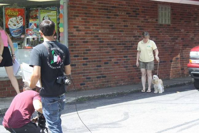Isabelle arrives at the Dairy Queen with Lisa Gaertner as the Animal Planet crew waits for her.
