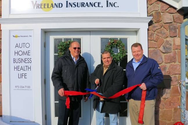 From left, owner and presidentof Vreeland Insurance, Inc. Joseph Merullo, West Milford Councilman Luciano Signorino and Brian Ward, the company's operations manager at the ribbon cutting for the new location of Vreeland Insurance at Bearfort Shopping Village.