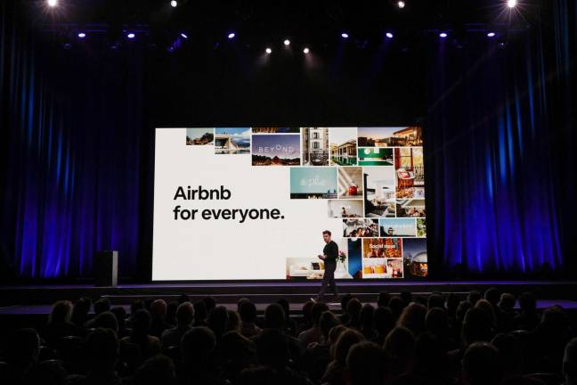 Airbnb photo Co-founder Brian Chesky addresses Airbnb company employees in February.