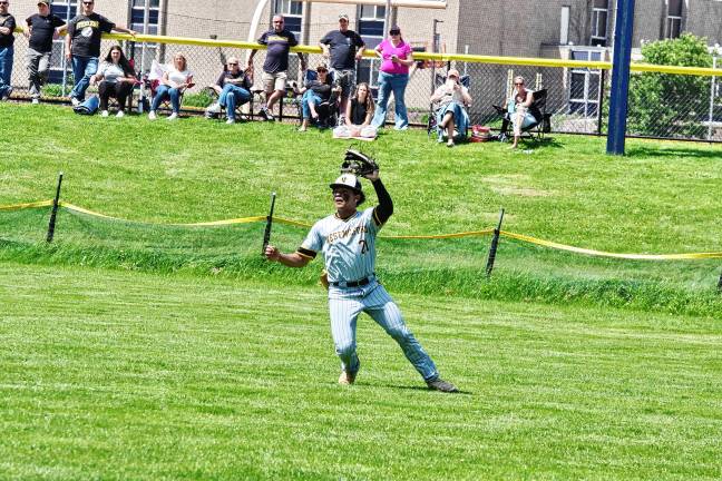 West Milford outfielder Jonas Paulino has the ball in his glove during a play.