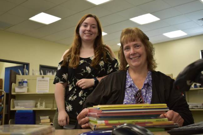 MaryAnne Quaife, front, and Vanessa Susen are circulation assistants. (Photos by Rich Adamonis)